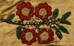 detail of red and green floral beading